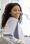 Happy Young Black Female Patient Sitting In Chair At Dental Clinic